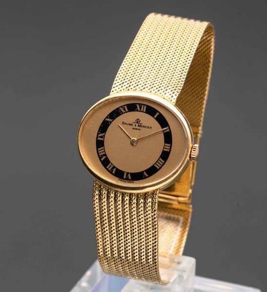 BAUME & MERCIER - Orologio da donna in oro 18k con bracciale integrato, quadrante champagne e nero con numeri Romani  - Asta Orologi da Polso e da Tasca - Associazione Nazionale - Case d'Asta italiane