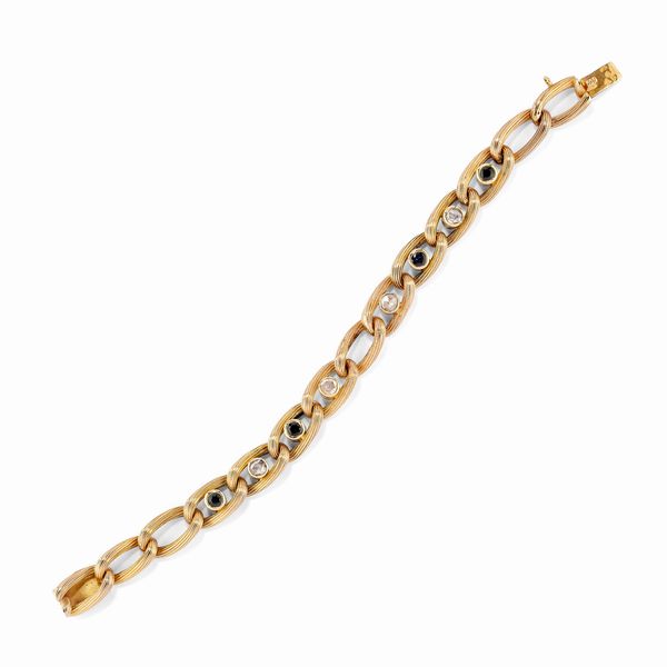 Bracciale in oro rosso 18K con diamanti e zaffiri  - Asta Gioielli - Associazione Nazionale - Case d'Asta italiane