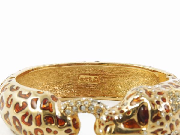 Bracciale rigido animalier in metallo dorato, Ciner  - Asta Abiti e accessori vintage  - Associazione Nazionale - Case d'Asta italiane