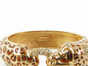 Bracciale rigido animalier in metallo dorato, Ciner  - Asta Abiti e accessori vintage  - Associazione Nazionale - Case d'Asta italiane