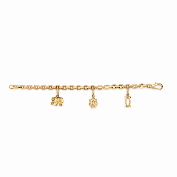 CARTIER : Bracciale charms in oro giallo 18k  - Asta Argenti dal XVIII al XX secolo - Associazione Nazionale - Case d'Asta italiane