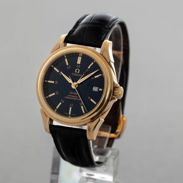 OMEGA - De Ville Coaxial in oro giallo 18k, automatico con scappamento Coassiale, datario e doppio fuso orario accompagnato da scatola e garanzia  - Asta Orologio da polso e da tasca  - Associazione Nazionale - Case d'Asta italiane