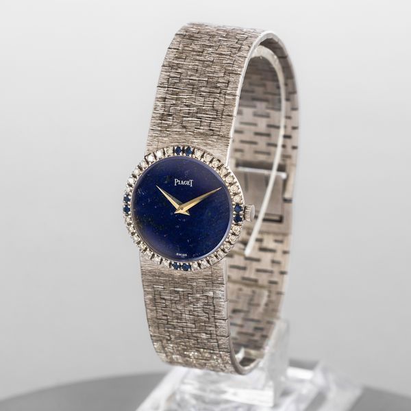 PIAGET - Raffinato orologio femminile da sera in oro bianco 18k, quadrante in Lapis e ghiera diamanti e zaffiri, carica manuale  - Asta Orologio da polso e da tasca  - Associazione Nazionale - Case d'Asta italiane