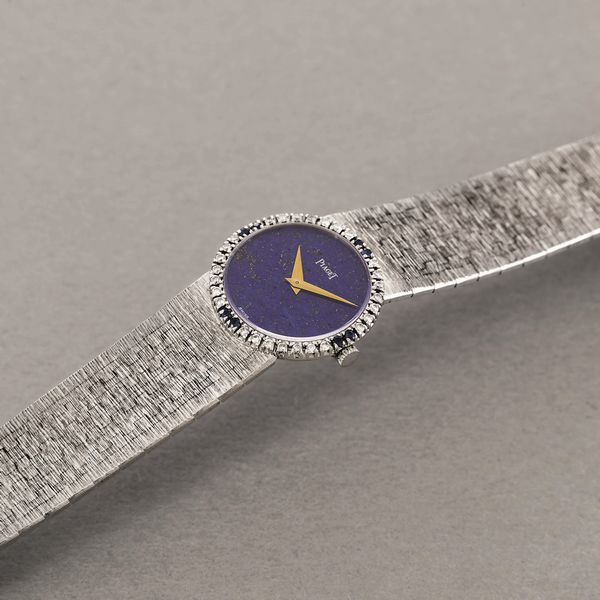 PIAGET - Raffinato orologio femminile da sera in oro bianco 18k, quadrante in Lapis e ghiera diamanti e zaffiri, carica manuale  - Asta Orologio da polso e da tasca  - Associazione Nazionale - Case d'Asta italiane