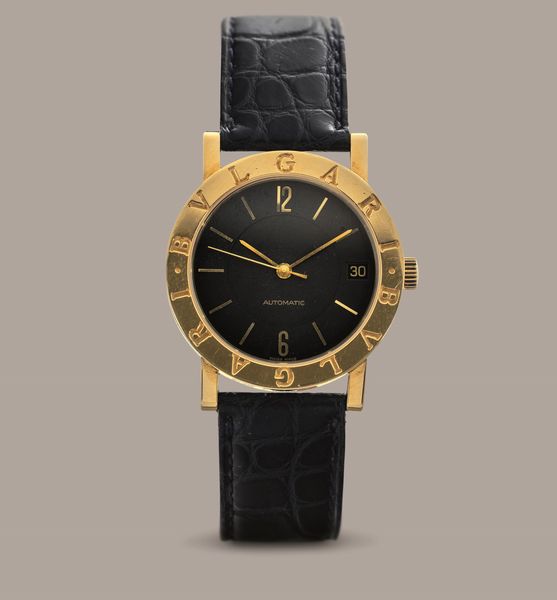 BULGARI - Bulgari in oro giallo 18k automatico con datario, quadrante nero con indici a bastone e numeri Arabi, fondello a pressione  - Asta Orologio da polso e da tasca  - Associazione Nazionale - Case d'Asta italiane