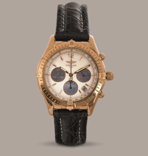 BREITLING - Chrono cockpit in oro giallo 18k, quadrante in madreperla con contatori azzurri, movimento automatico con scatola, garanzia e certificato di cronometria  - Asta Orologio da polso e da tasca  - Associazione Nazionale - Case d'Asta italiane