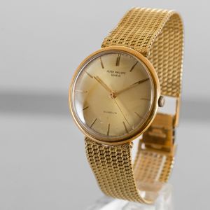 PATEK PHILIPPE - Calatrava in oro giallo 18k braccialato, quadrante dorato personalizzato per Gubelin con indici applicati, secondi centrali  - Asta Orologio da polso e da tasca  - Associazione Nazionale - Case d'Asta italiane