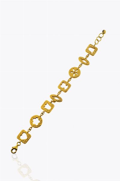 BRACCIALE : Peso gr10 5 Lunghezza cm 19 in oro rosa  composto a da formelle rigide satinate con al centro decori traforati  firmato Tous.  - Asta Gioielli - Associazione Nazionale - Case d'Asta italiane