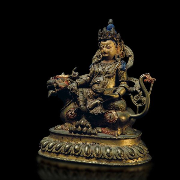 Figura di Sita-Jambhala seduto su drago in bronzo dorato con tracce di policromia, Cina, Dinastia Qing, epoca Qianlong (1736-1796)  - Asta Fine Chinese Works of Art - Associazione Nazionale - Case d'Asta italiane