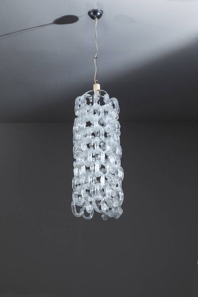 F.LLI TOSO : Lampadario con struttura in metallo ed elementi diffusori componibili in vetro di Murano. Prod. F.lli Toso anni '70 cm 125x30  - Asta Design - Associazione Nazionale - Case d'Asta italiane