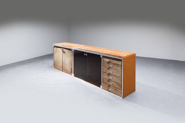 GUIDO FALESCHINI : Credenza da due elementi con struttura rivestita velluto profili in acciaio satinato e piano in marmo.  Prod. I Mariani anni '70 cm 85x250x46  - Asta Design - Associazione Nazionale - Case d'Asta italiane