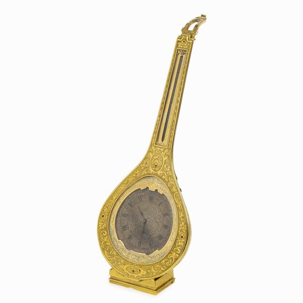 Orologio da viaggio in bronzo dorato e cesellato a guisa di mandolino. Francia XIX secolo  - Asta Dimore italiane - Associazione Nazionale - Case d'Asta italiane