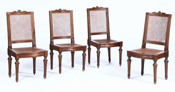 Quattro sedie e poltrona Luigi XVI in noce, XVIII-XIX secolo  - Asta Antiquariato - Associazione Nazionale - Case d'Asta italiane
