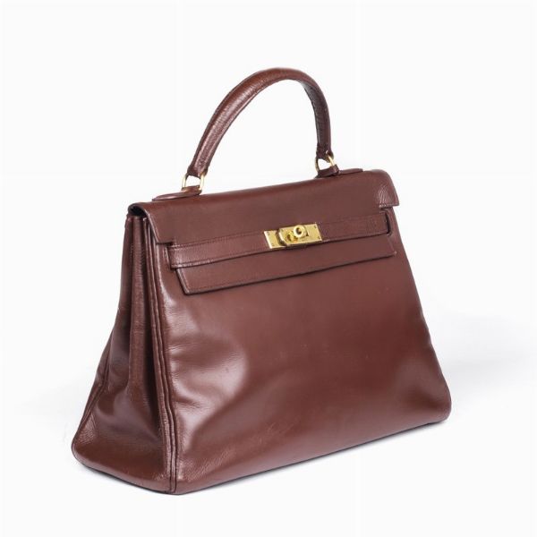 HERMES : HERMES VINTAGE KELLY RETOURNE 32  - Asta VINTAGE: BORSE E ACCESSORI DI HERMES, LOUIS VUITTON E ALTRE GRANDI MAISON - Associazione Nazionale - Case d'Asta italiane