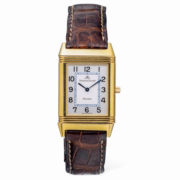 Jaeger-LeCoultre : Classico ed iconico Reverso Classique in oro giallo 18k quadrante Argent bitonale con numeri Arabi, cinturino in pelle con chiusura deployante, accompagnato da scatola e garanzia  - Asta Orologi da Polso e da Tasca - Associazione Nazionale - Case d'Asta italiane