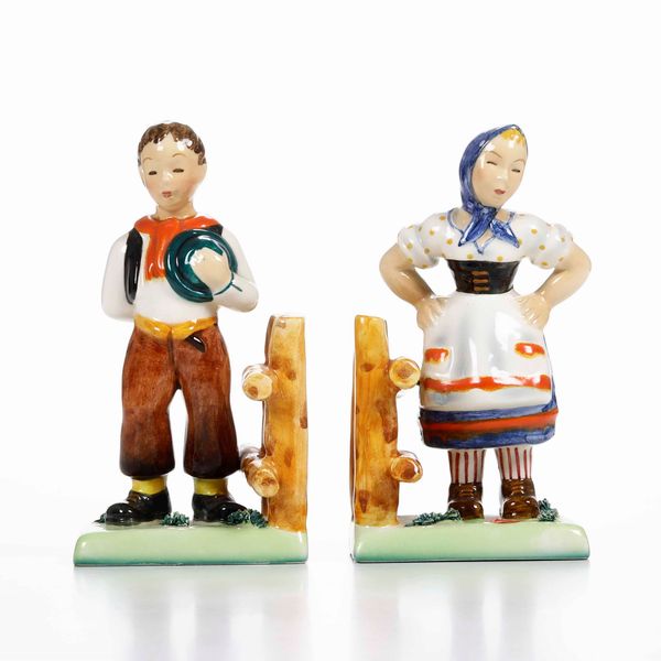 Una coppia di figurine e una coppia di reggilibri <BR>Italia, prima met de XX secolo  - Asta Ceramiche - Associazione Nazionale - Case d'Asta italiane