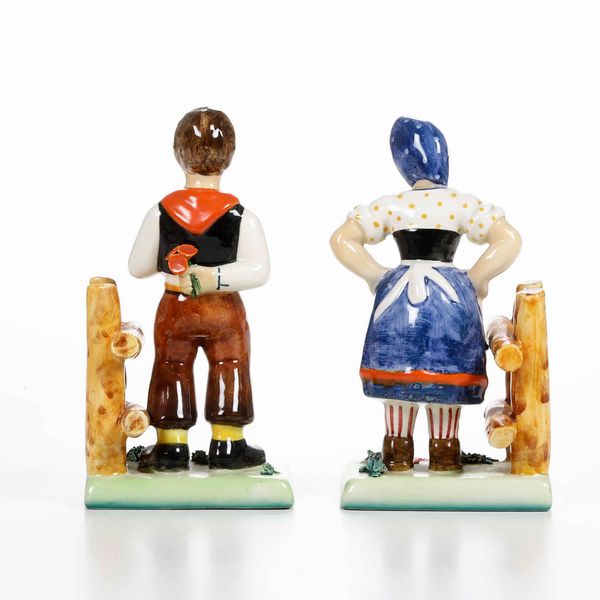 Una coppia di figurine e una coppia di reggilibri <BR>Italia, prima met de XX secolo  - Asta Ceramiche - Associazione Nazionale - Case d'Asta italiane