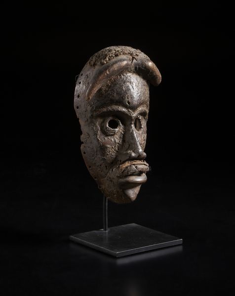 Dan - Costa d'Avorio/Liberia : Maschera antropomorfa con corna. Legno duro a patina nera crostosa.  - Asta Asta 422 | AFRICA, OCEANIA E AMERICHE - ARTIGIANATO AFRICANO: VARI COMMITTENTI E SELEZIONE DALLA COLLEZIONE BARTOLOMUCCI Online - Associazione Nazionale - Case d'Asta italiane