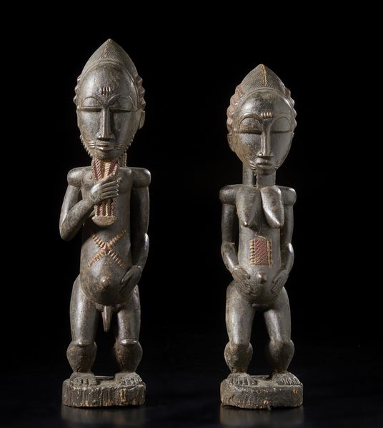 Baule - Costa d'Avorio : Coppia di sculture antropomorfe Blolo bian e Blolo bla.Legno duro a patina scura e pigmenti.  - Asta Asta 422 | AFRICA, OCEANIA E AMERICHE - ARTIGIANATO AFRICANO: VARI COMMITTENTI E SELEZIONE DALLA COLLEZIONE BARTOLOMUCCI Online - Associazione Nazionale - Case d'Asta italiane