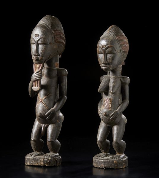 Baule - Costa d'Avorio : Coppia di sculture antropomorfe Blolo bian e Blolo bla.Legno duro a patina scura e pigmenti.  - Asta Asta 422 | AFRICA, OCEANIA E AMERICHE - ARTIGIANATO AFRICANO: VARI COMMITTENTI E SELEZIONE DALLA COLLEZIONE BARTOLOMUCCI Online - Associazione Nazionale - Case d'Asta italiane