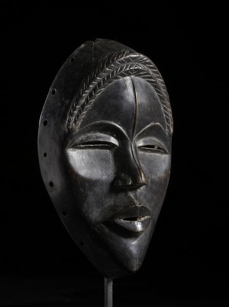 Dan - Costa d'Avorio/Liberia : Maschera antropomorfa con occhi a fessura e treccia frontale. Legno duro a patina nera.  - Asta Asta 422 | AFRICA, OCEANIA E AMERICHE - ARTIGIANATO AFRICANO: VARI COMMITTENTI E SELEZIONE DALLA COLLEZIONE BARTOLOMUCCI Online - Associazione Nazionale - Case d'Asta italiane