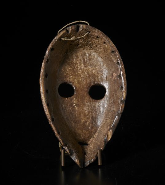 Dan - Costa d'Avorio/Liberia : Maschera antropomorfa. Legno duro a patina scura.  - Asta Asta 422 | AFRICA, OCEANIA E AMERICHE - ARTIGIANATO AFRICANO: VARI COMMITTENTI E SELEZIONE DALLA COLLEZIONE BARTOLOMUCCI Online - Associazione Nazionale - Case d'Asta italiane