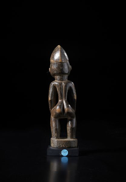 Senufo - Costa d'Avorio/Mali : Scultura antropomorfa.Legno duro a patina scura.  - Asta Asta 422 | AFRICA, OCEANIA E AMERICHE - ARTIGIANATO AFRICANO: VARI COMMITTENTI E SELEZIONE DALLA COLLEZIONE BARTOLOMUCCI Online - Associazione Nazionale - Case d'Asta italiane