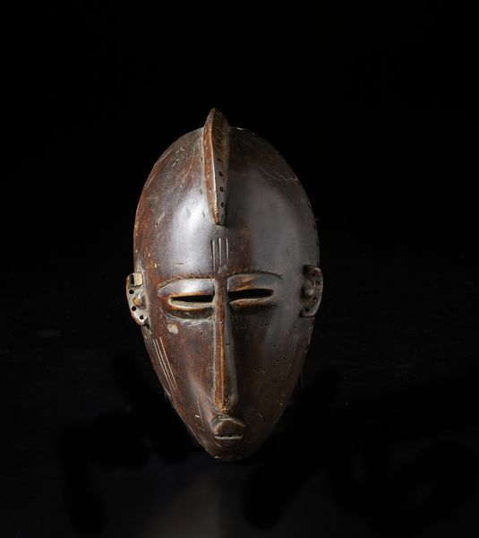 Mossi - Burkina Faso : Maschera antropomorfa. Legno con patina marrone.  - Asta Asta 422 | AFRICA, OCEANIA E AMERICHE - ARTIGIANATO AFRICANO: VARI COMMITTENTI E SELEZIONE DALLA COLLEZIONE BARTOLOMUCCI Online - Associazione Nazionale - Case d'Asta italiane