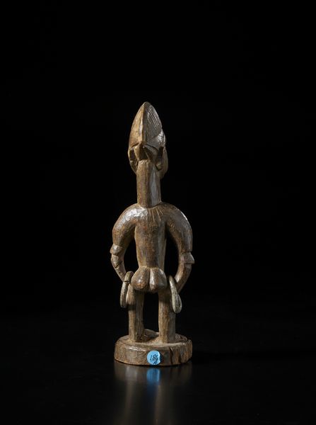 Yoruba -Nigeria : Scultura antropomorfa di gemello singolo Ibeji.Legno a patina bruna e metallo.  - Asta Asta 422 | AFRICA, OCEANIA E AMERICHE - ARTIGIANATO AFRICANO: VARI COMMITTENTI E SELEZIONE DALLA COLLEZIONE BARTOLOMUCCI Online - Associazione Nazionale - Case d'Asta italiane