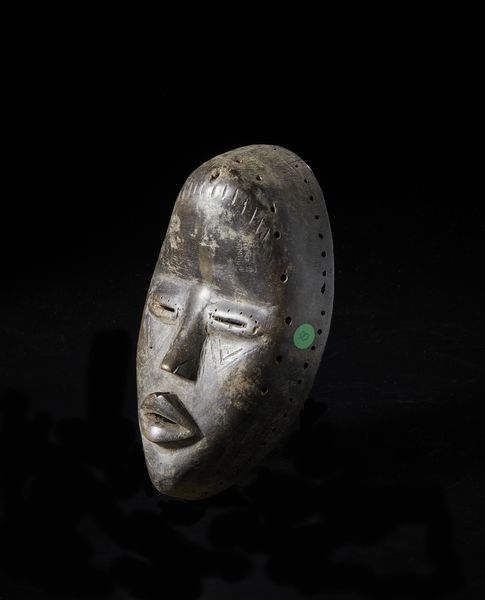 Dan - Costa d'Avorio/Liberia : Maschera antropomorfa con occhi a fessura. Legno duro a patina scura.  - Asta Asta 422 | AFRICA, OCEANIA E AMERICHE - ARTIGIANATO AFRICANO: VARI COMMITTENTI E SELEZIONE DALLA COLLEZIONE BARTOLOMUCCI Online - Associazione Nazionale - Case d'Asta italiane