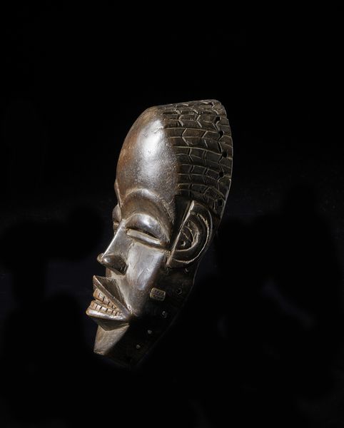 Dan - Costa d'Avorio/Liberia : Maschera antropomorfa.  Legno duro a patina marrone.  - Asta Asta 422 | AFRICA, OCEANIA E AMERICHE - ARTIGIANATO AFRICANO: VARI COMMITTENTI E SELEZIONE DALLA COLLEZIONE BARTOLOMUCCI Online - Associazione Nazionale - Case d'Asta italiane