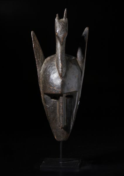 Bambara - Mali : Maschera zoomorfa in forma di iena sormontata da testa di antilope. Legno duro con patina scura.  - Asta Asta 422 | AFRICA, OCEANIA E AMERICHE - ARTIGIANATO AFRICANO: VARI COMMITTENTI E SELEZIONE DALLA COLLEZIONE BARTOLOMUCCI Online - Associazione Nazionale - Case d'Asta italiane