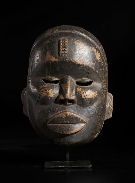 Ibibio, Nigeria : Maschera antropomorfa.Legno duro a patina nera.  - Asta Asta 422 | AFRICA, OCEANIA E AMERICHE - ARTIGIANATO AFRICANO: VARI COMMITTENTI E SELEZIONE DALLA COLLEZIONE BARTOLOMUCCI Online - Associazione Nazionale - Case d'Asta italiane