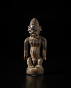 Yoruba -Nigeria - Scultura antropomorfa di gemello Ibeji singolo. Legno a patina scura.