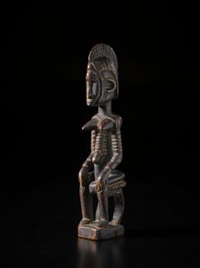 Mossi - Burkina Faso - Scultura antropomorfa femminile seduta su seggio.Legno a patina scura.