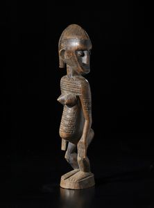 Bambara - Mali - Scultura antropomorfa con testa di profilo.Legno duro a patina bruna e scura.