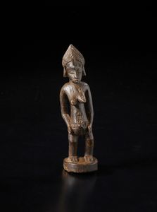 Senufo - Costa d'Avorio/Mali/Burkina Faso - Scultura antropomorfa.Legno duro a patina marrone.