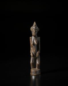 Senufo - Costa d'Avorio/Mali - Scultura antropomorfa.Legno duro a patina bruna.