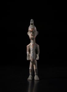 Igbo - Nigeria - Scultura antropomorfa. Legno a patina scura e pigmenti.