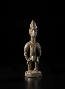 Yoruba -Nigeria - Scultura antropomorfa di gemello singolo Ibeji.Legno a patina bruna e metallo.