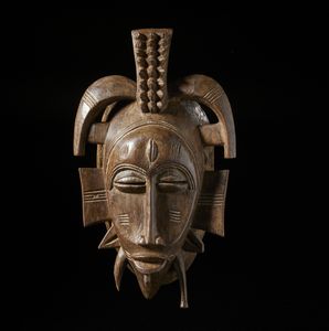 Senufo - Costa d'Avorio/Mali/Burkina Faso - Maschera Kple.Legno duro a patina marrone.