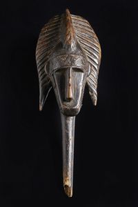 Marka, Mali - Testa di marionetta antropomorfa. Legno a patina scura e metallo.