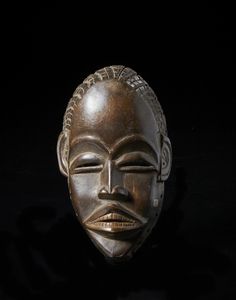 Dan - Costa d'Avorio/Liberia - Maschera antropomorfa.  Legno duro a patina marrone.