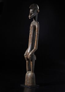 Senufo - Costa d'Avorio/Mali - Grande scultura antropomorfa. Legno duro a patina marrone.