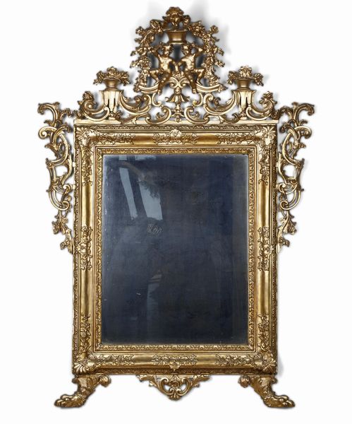 Specchiera in legno intagliato e dorato. XVIII secolo  - Asta Antiquariato e dipinti - Associazione Nazionale - Case d'Asta italiane