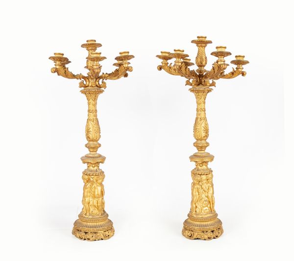 Coppia di candelabri in metallo dorato a sette luci, XIX secolo  - Asta Antiquariato - Mobili, Sculture e Oggetti d'Arte - Associazione Nazionale - Case d'Asta italiane