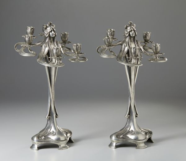 GAMBA ACHILLE (1881 - 1944) : Attribuito a. Coppia di candelabri Art Nouveau a sei fiamme in metallo argentato in forma di figure femminili  - Asta Asta 423 | ARTE ANTICA E DEL XIX SECOLO Online - Associazione Nazionale - Case d'Asta italiane