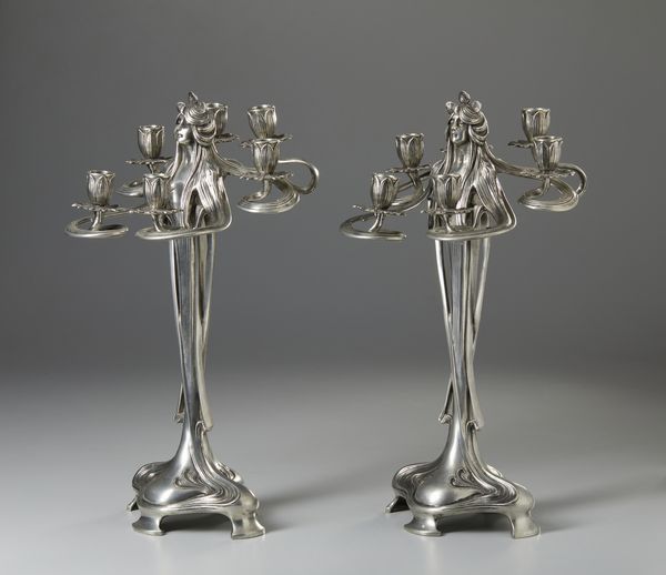 GAMBA ACHILLE (1881 - 1944) : Attribuito a. Coppia di candelabri Art Nouveau a sei fiamme in metallo argentato in forma di figure femminili  - Asta Asta 423 | ARTE ANTICA E DEL XIX SECOLO Online - Associazione Nazionale - Case d'Asta italiane