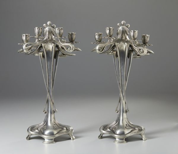 GAMBA ACHILLE (1881 - 1944) : Attribuito a. Coppia di candelabri Art Nouveau a sei fiamme in metallo argentato in forma di figure femminili  - Asta Asta 423 | ARTE ANTICA E DEL XIX SECOLO Online - Associazione Nazionale - Case d'Asta italiane