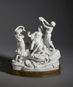 MANIFATTURA DI SEVRES DEL XIX SECOLO - Gruppo in biscuit raffigurante un Baccanale, su base in bronzo dorato